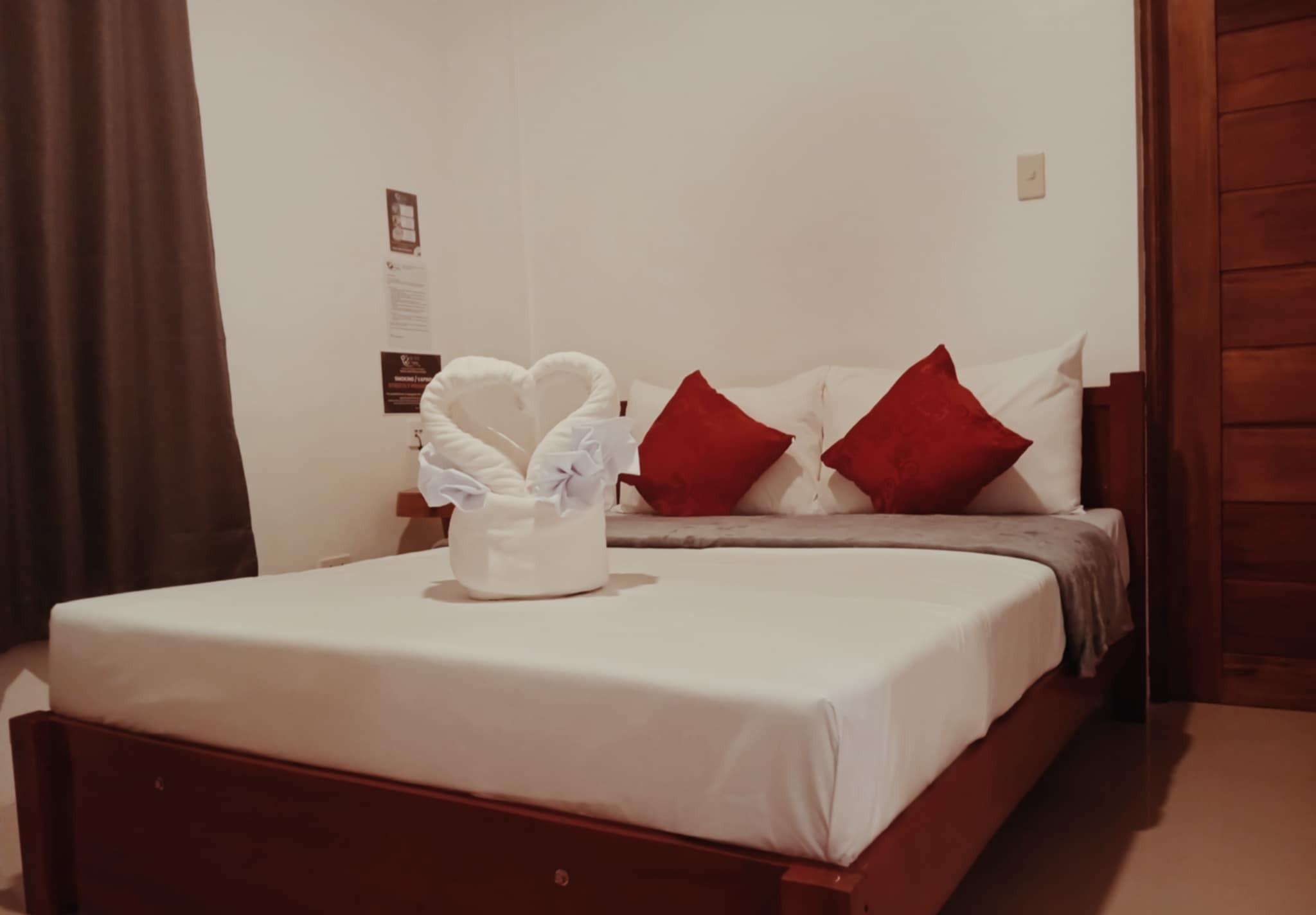 Bedroom and entertainment area at Hotel Tugatog